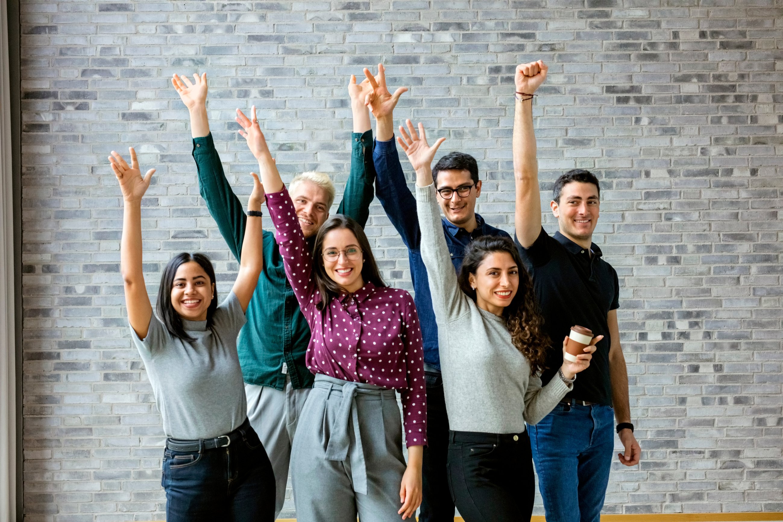 Happy business people celebrating success at office