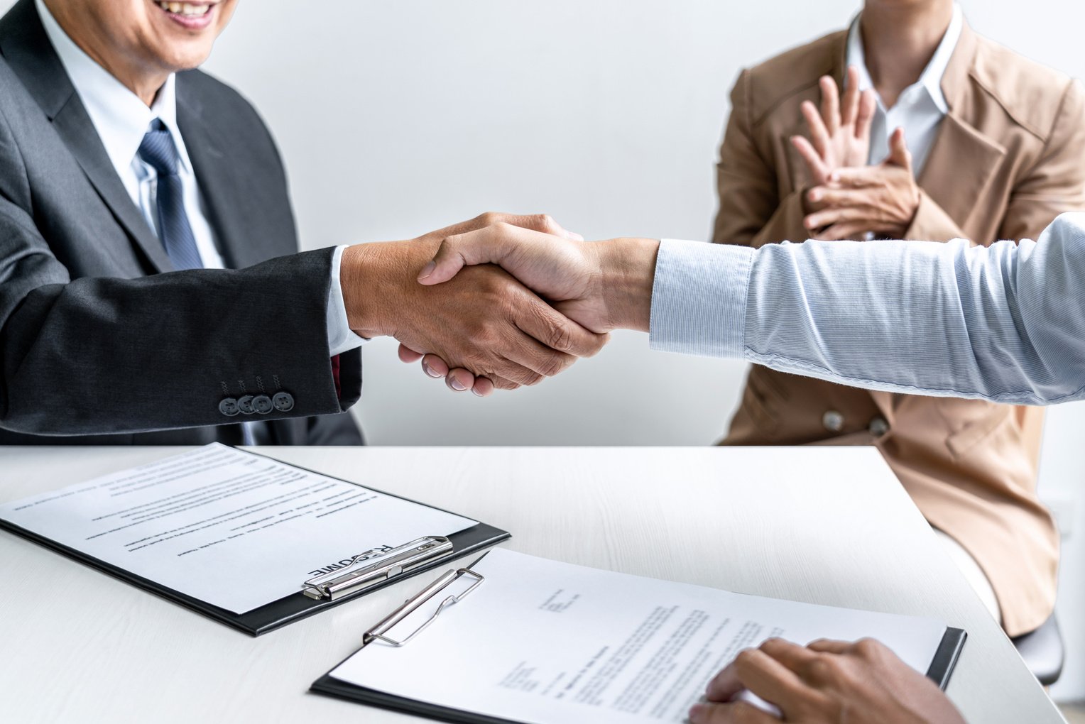 Employer Shaking Hands of New Hire